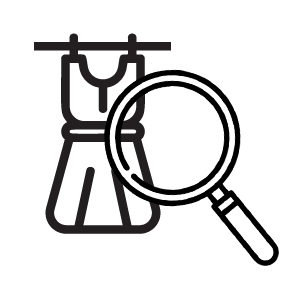 A magnifying glass is looking at a dress hanging on a rack.