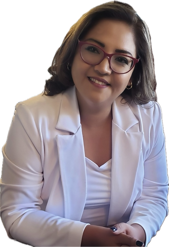 Woman in white blazer and glasses smiles, indoors.