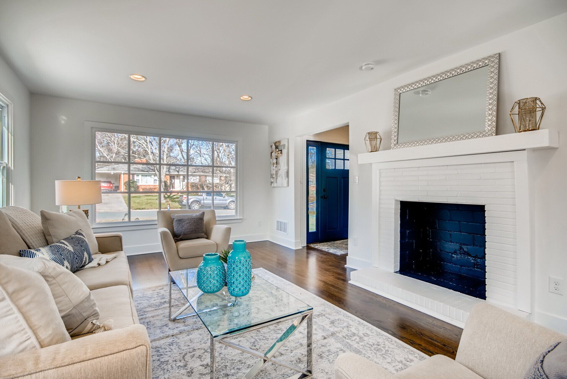 A living room filled with furniture and a fireplace.