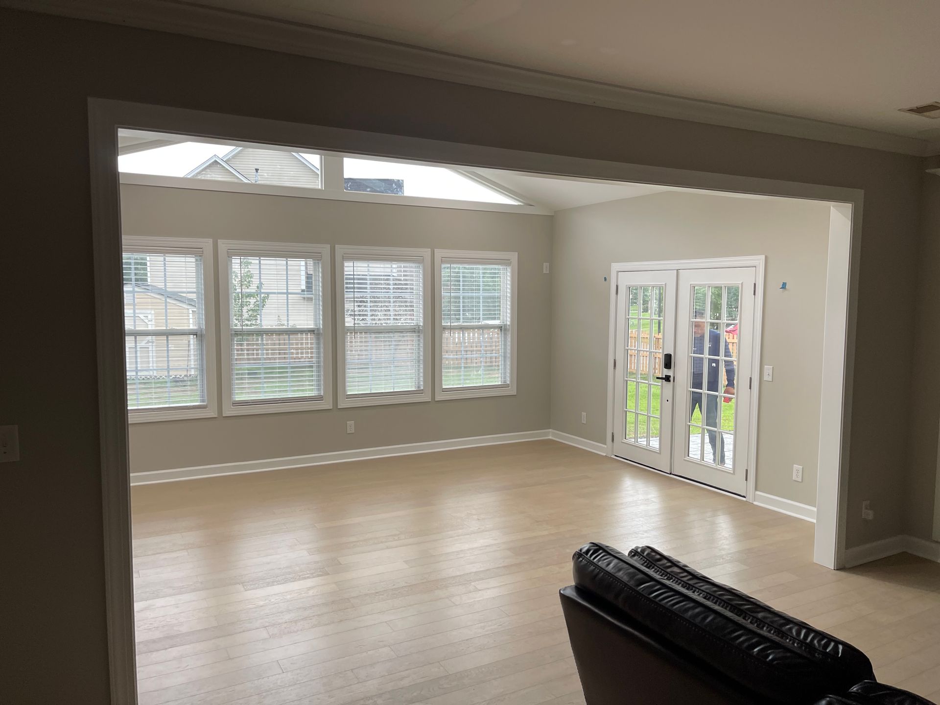 There is a skylight in the ceiling of the living room.