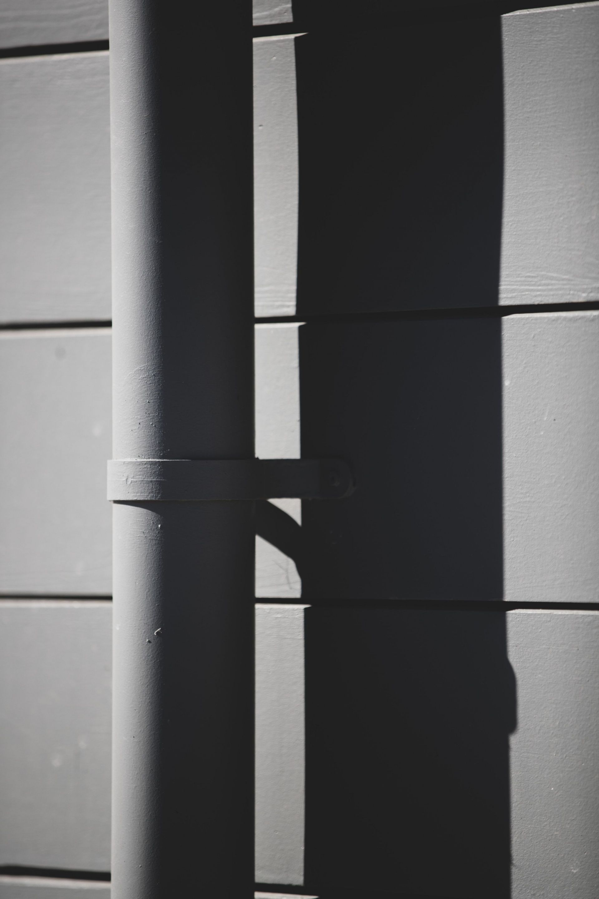 Grey Pipe Attached To Wall — Onehunga, Auckland — Ace Spouting & Fascia