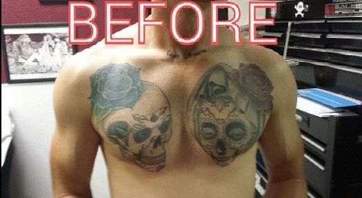 A man without a shirt has two skulls and roses tattooed on his chest.