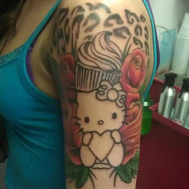 A woman has a hello kitty tattoo on her arm