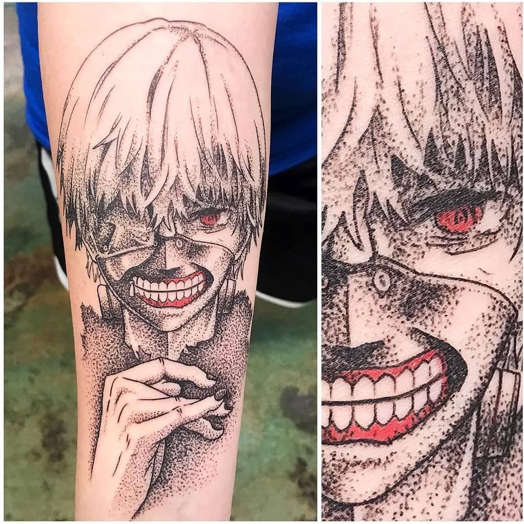 A person has a tattoo of tokyo ghoul ken kaneki on their arm.