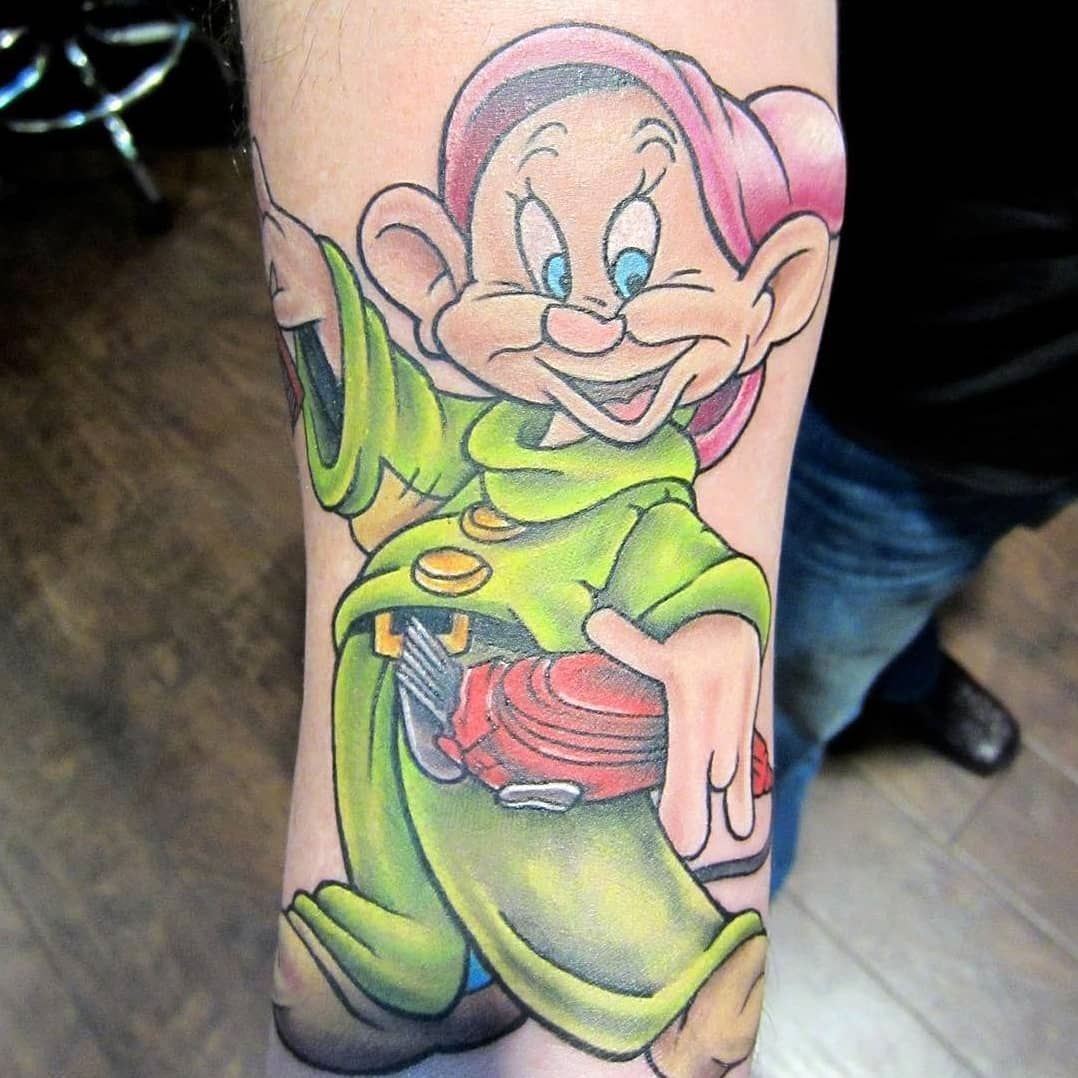 A tattoo of dopey from snow white and the seven dwarfs