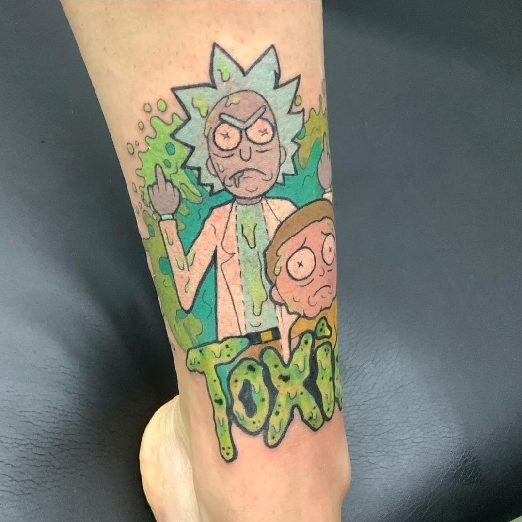 A person has a tattoo of rick and morty on their leg