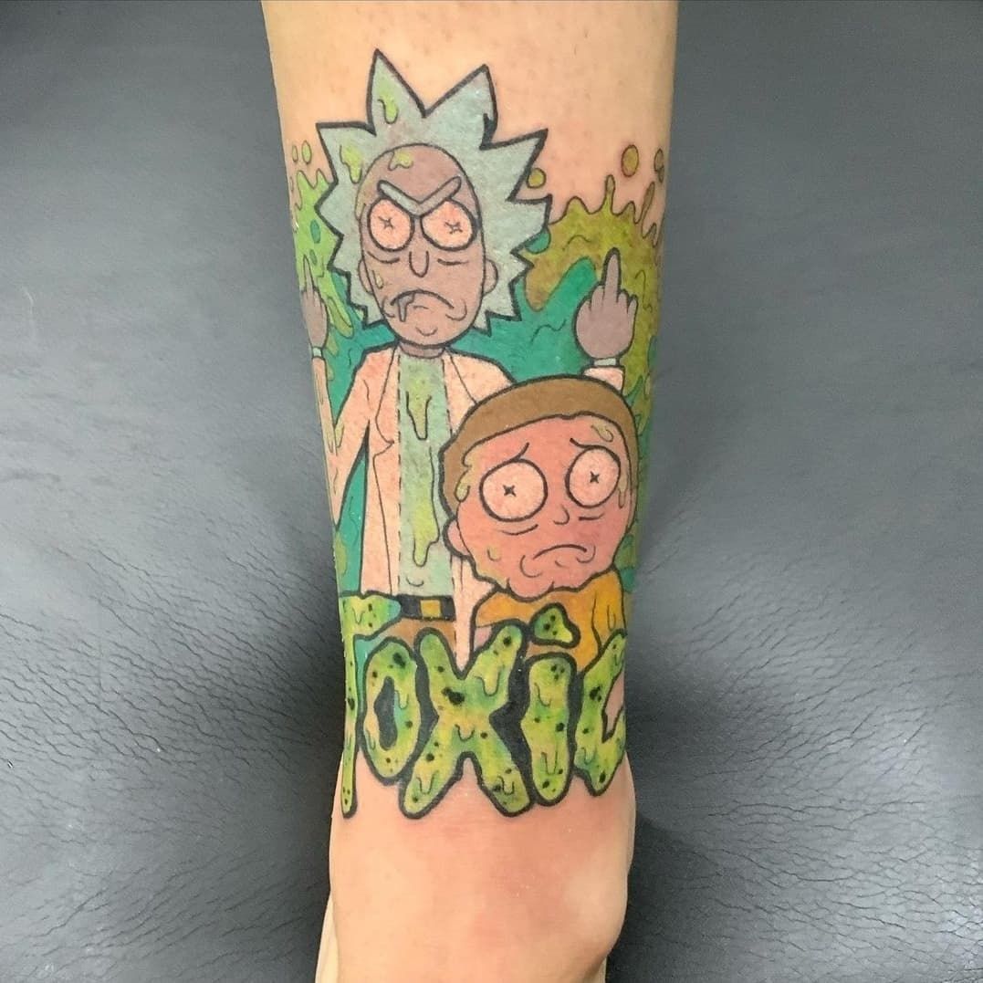 A person has a tattoo of rick and morty on their leg