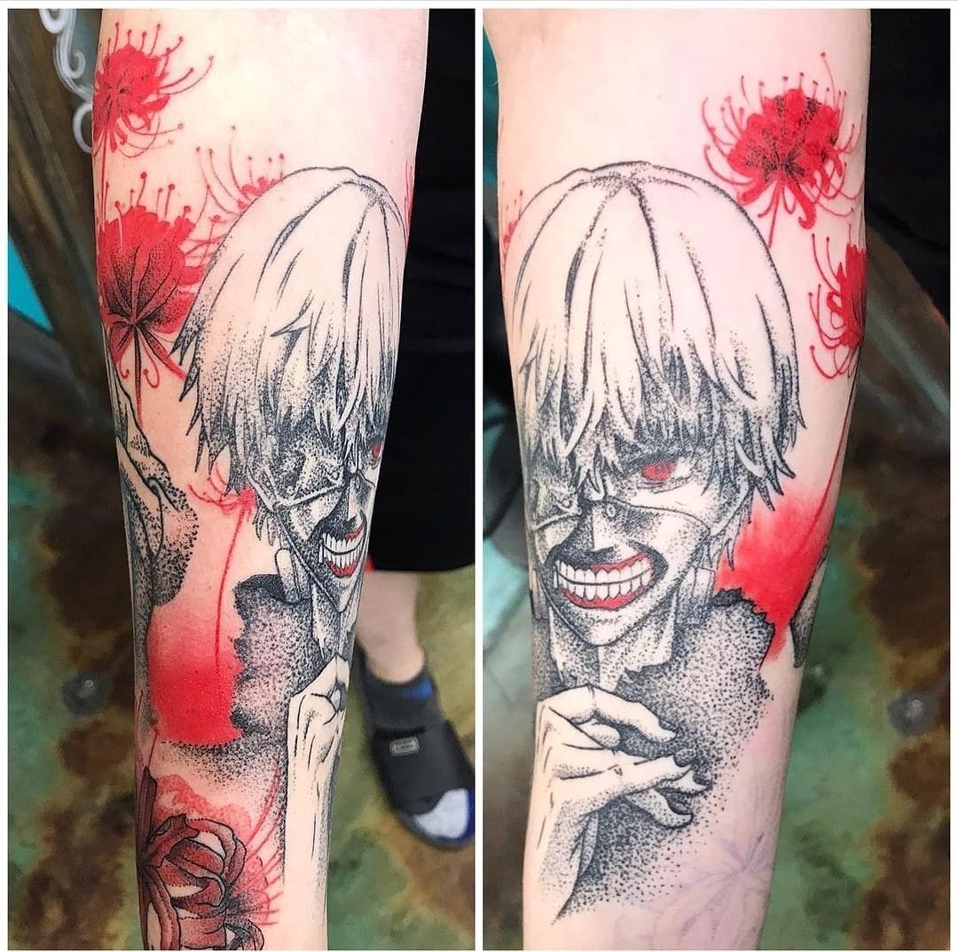 A person has a tattoo of a man with red eyes on their forearm.