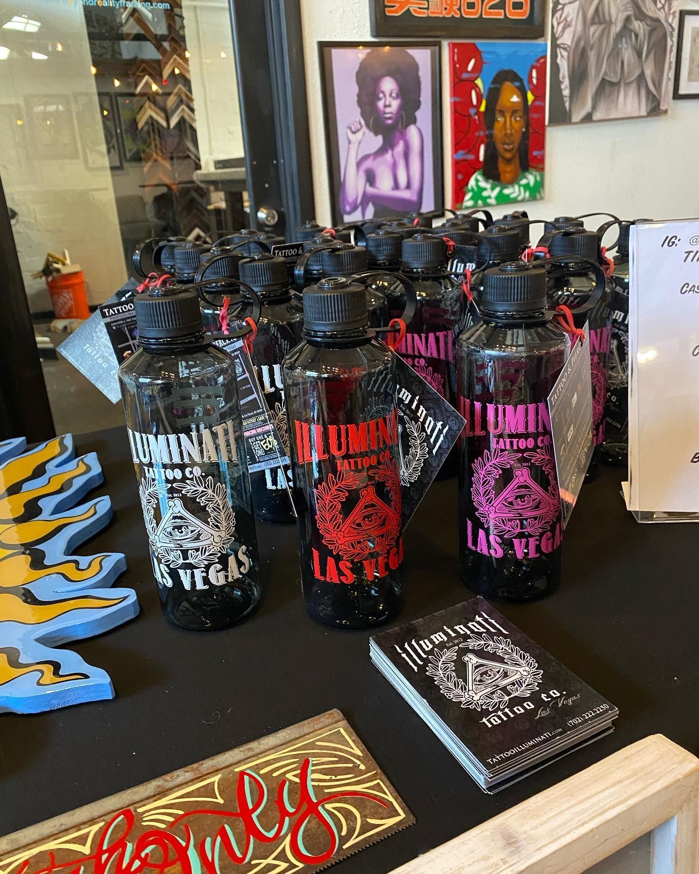 A bunch of water bottles on a table with a sign that says family