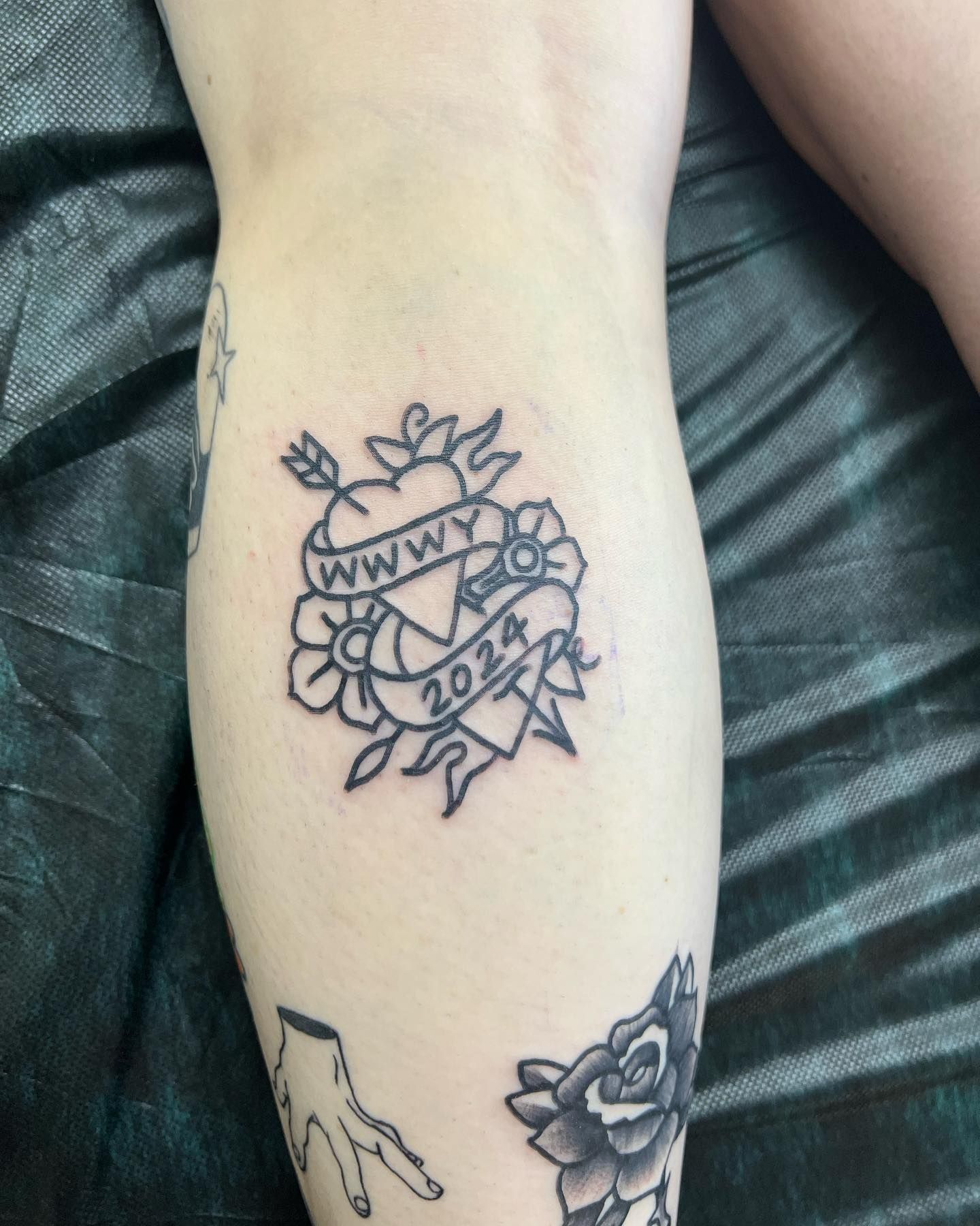 A tattoo on a person 's leg that says ' www ' on it