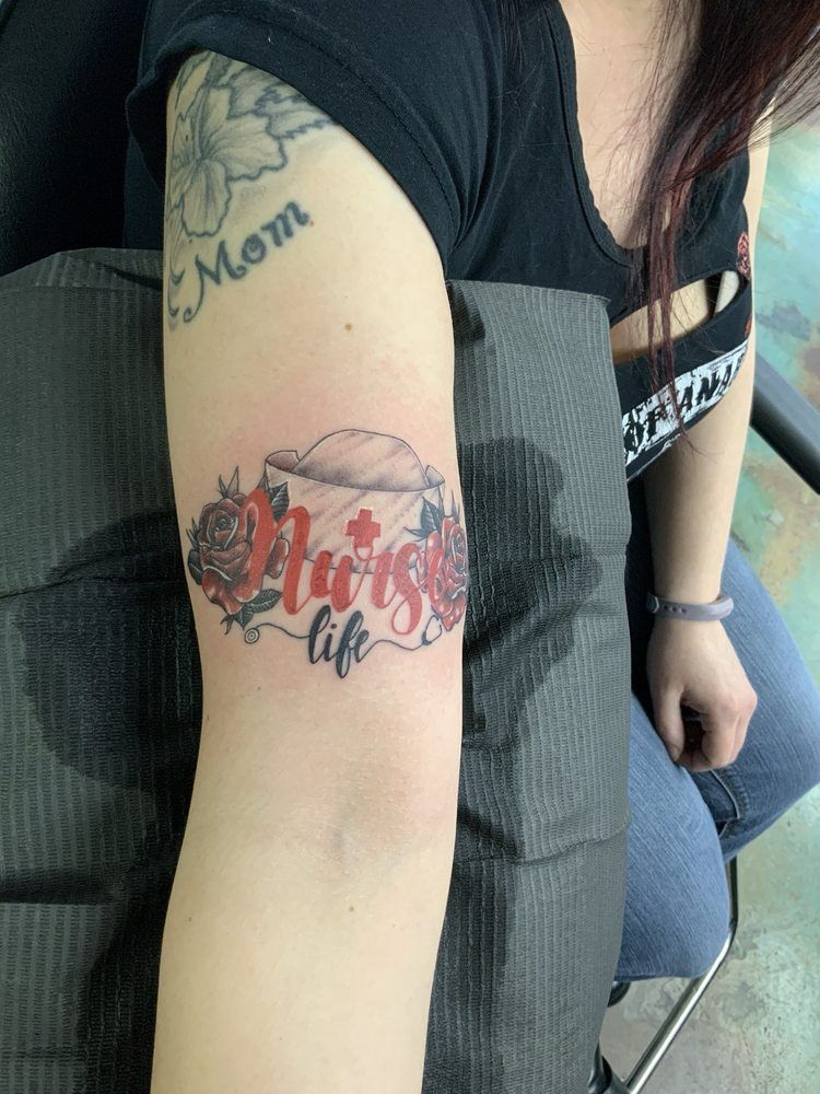 A woman has a tattoo on her arm that says autism life