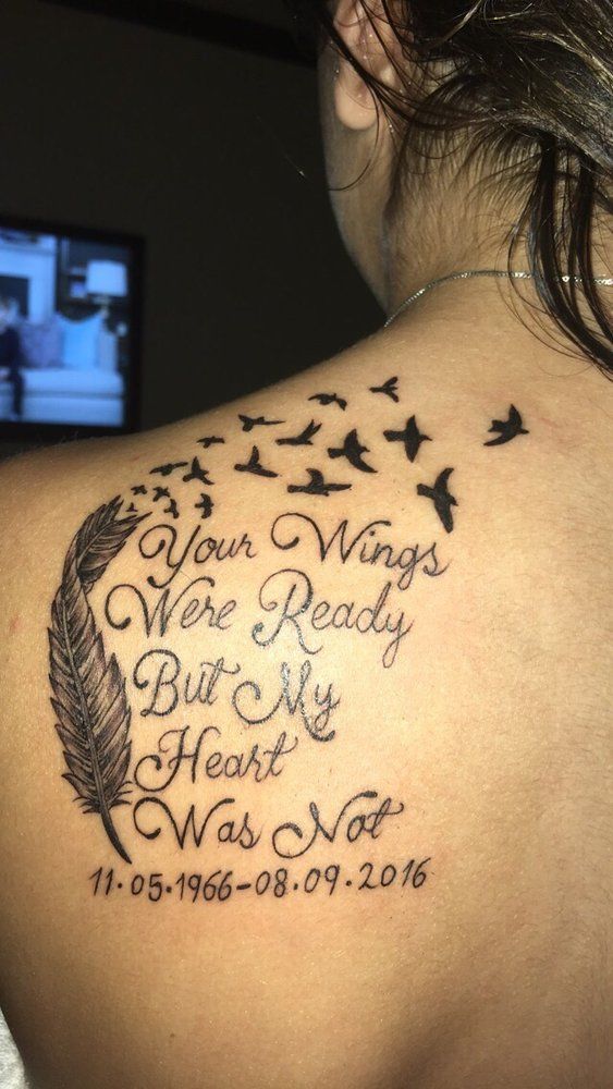 A woman has a tattoo on her back that says `` your wings were ready but my heart was not ''.