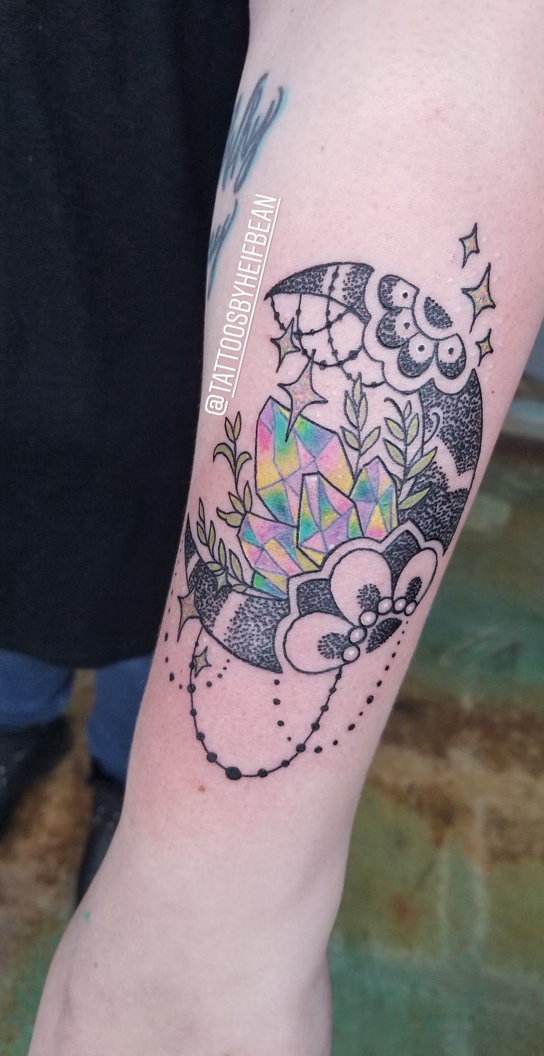 A close up of a person 's forearm with a tattoo on it