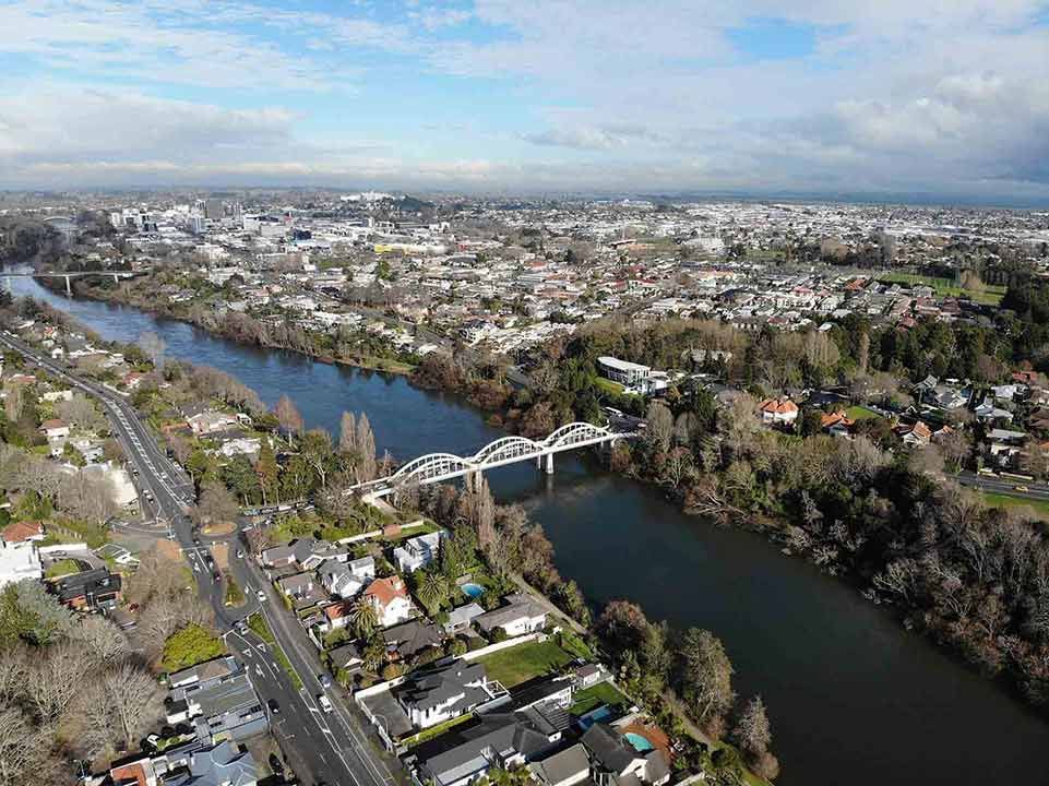 An Aerial View Of A Bridge Over A River In A City — Smith Aluminium In Hamilton, NSW