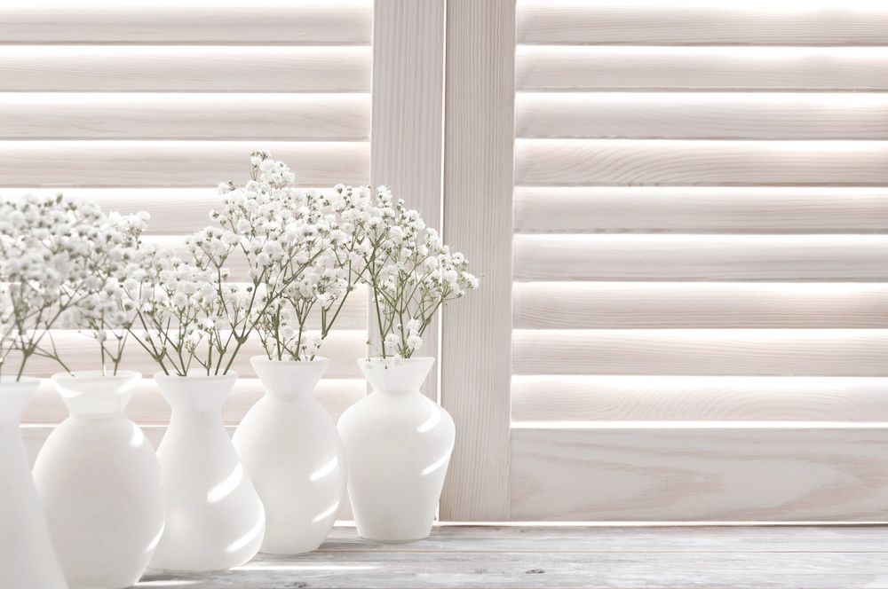 A Row Of White Vases On A Window Sill — Smith Aluminium In Belmont, NSW
