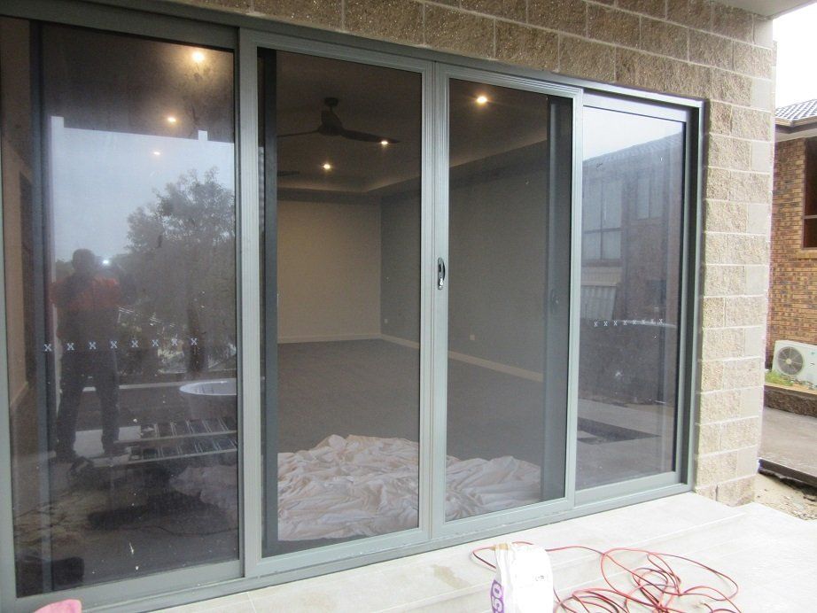 Glass Window With Flyscreen — Smith Aluminium In Medowie, NSW