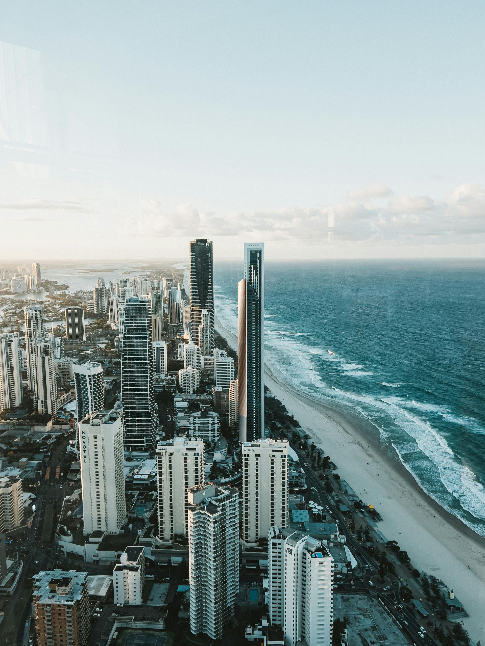View from above of tall buildings along Brisbane coast.