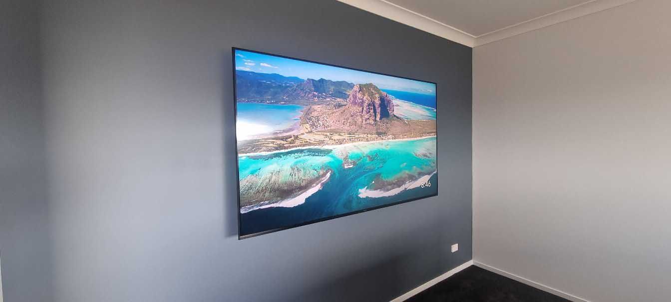 Wall Mounted Coloured TV — Toowoomba, QLD — Garden City Antennas