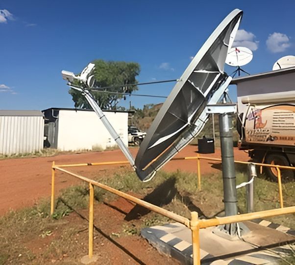 A Large Satellite Dish Is Sitting In The Middle Of A Dirt Field — Outback Internet & Comms In Ciccone, NT