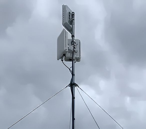 A Tower With Antennas On It Against A Cloudy Sky — Outback Internet & Comms In Ciccone, NT
