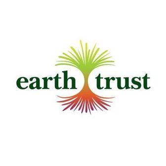 Earth Trust logo: green and red tree design with the words