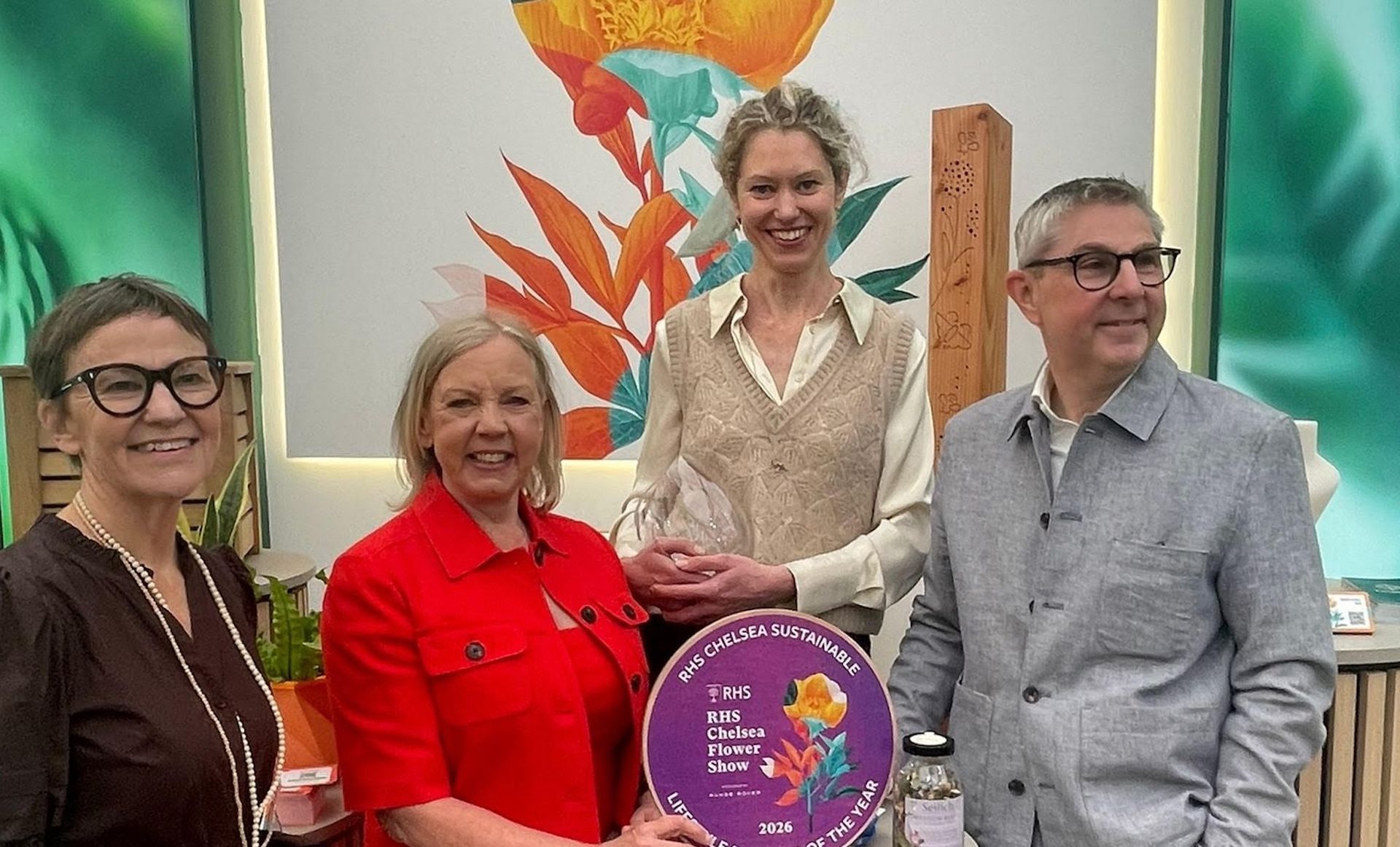 Deborah Meaden, Andree Davies pose indoors beside a winner of sustainable business of the year at RhS Chelsea 2026 