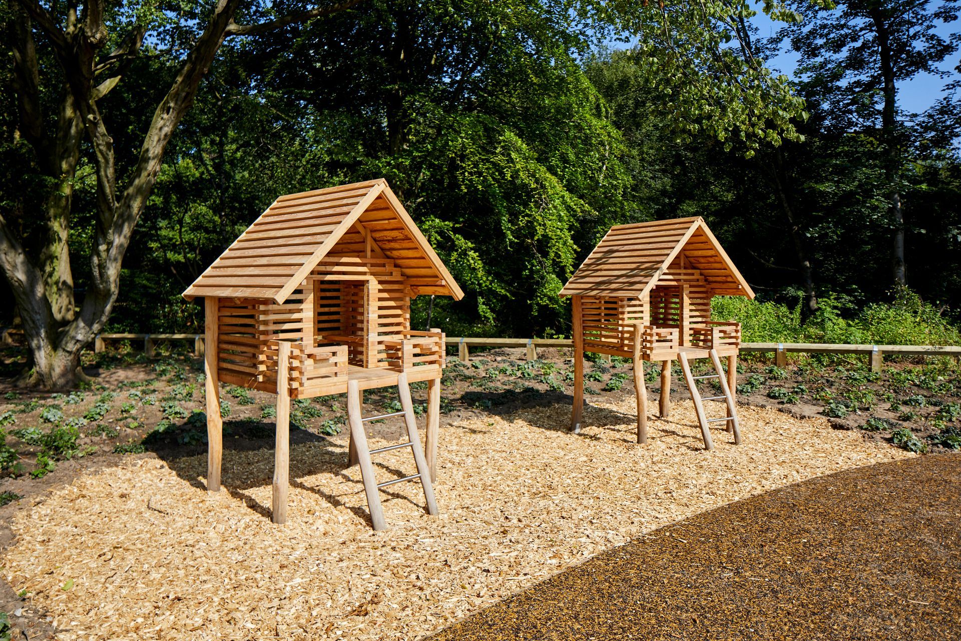 Small timber play house structures built by Massey & Harris for Davies White & Manchester City Council | Heaton Park