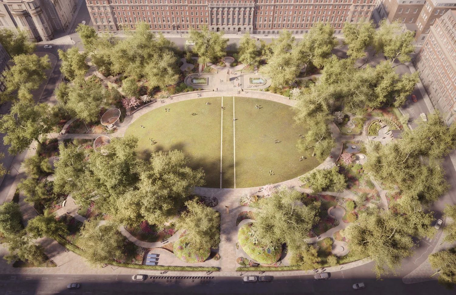 Aerial view of a park with trees, grassy oval, paths, and surrounding buildings.