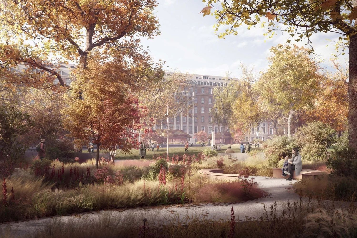 Park in autumn with colorful trees, people on benches, and a building in the background.