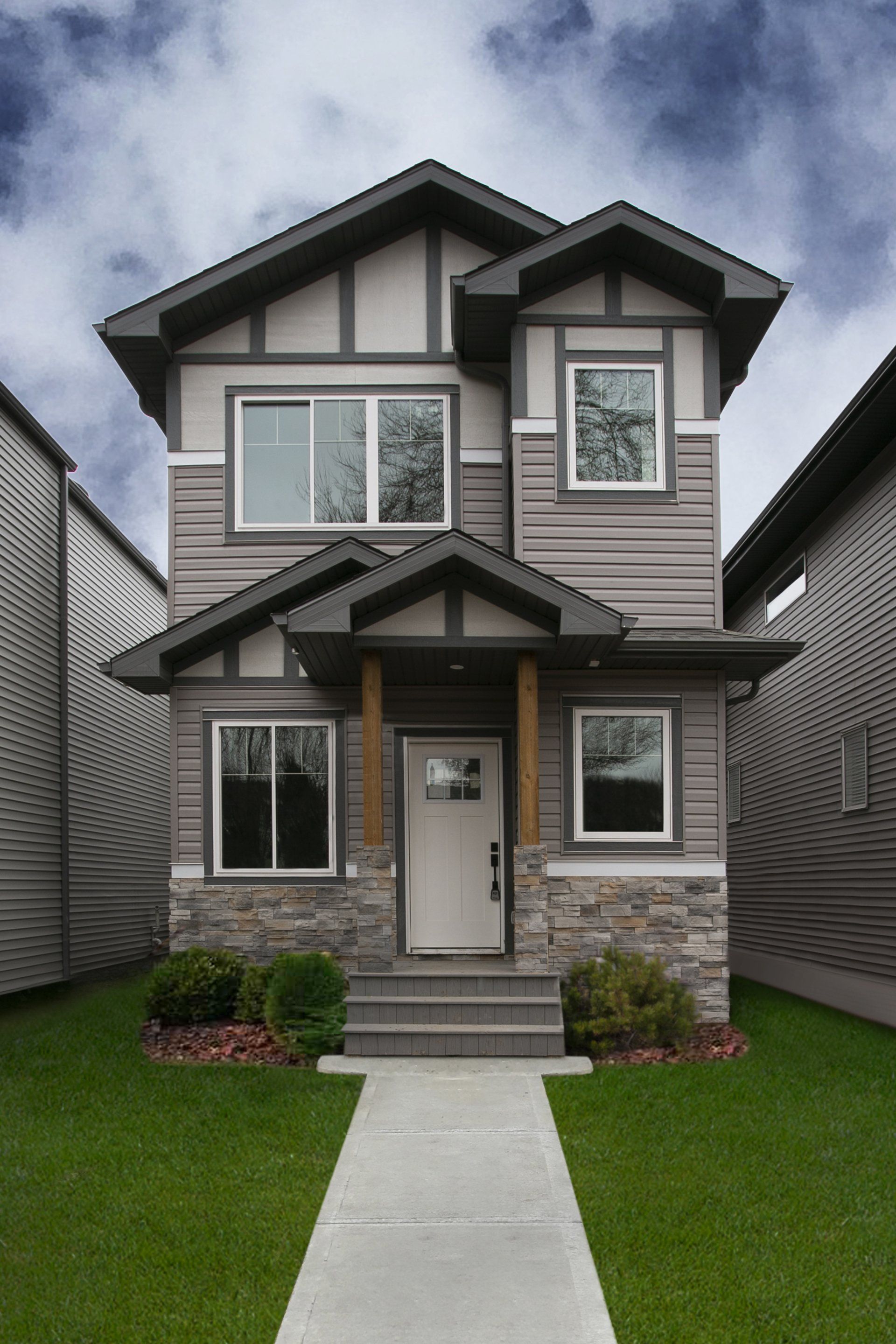 A house with a concrete walkway leading to it