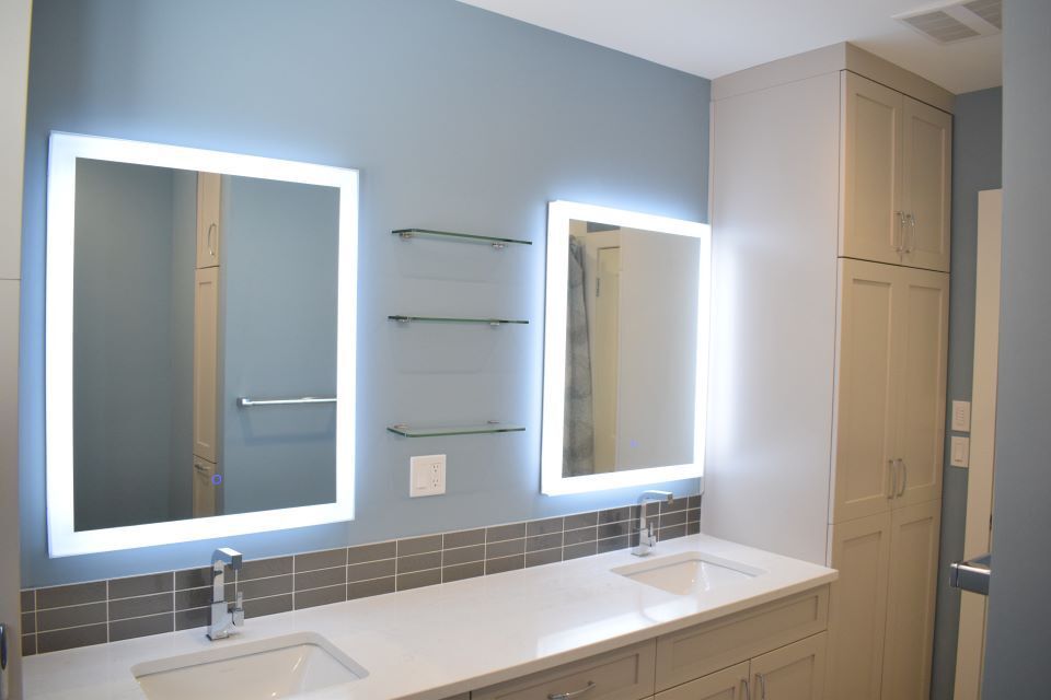 his and her mirrors and sink