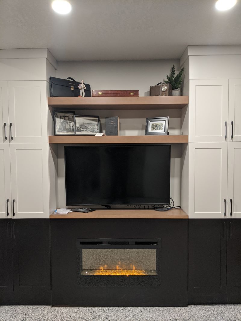 fireplace with mantle in garage