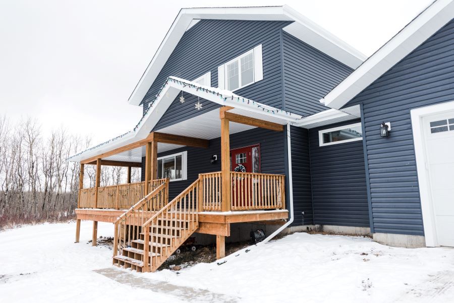 custom blue home with red door