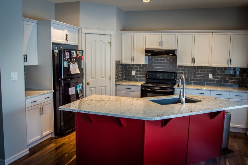 kitchen with red bottom island