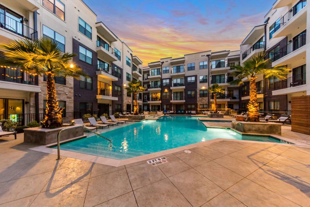 Swimming pool at night at Marq 31 in Houston, TX.
