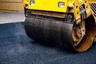 Steamroller Flatting the Asphalt - Paving Company in Jacksonville, IL