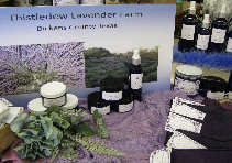 Chiltefcel Lavender Farm display with lavender products, bottles, jars, and purple tablecloth