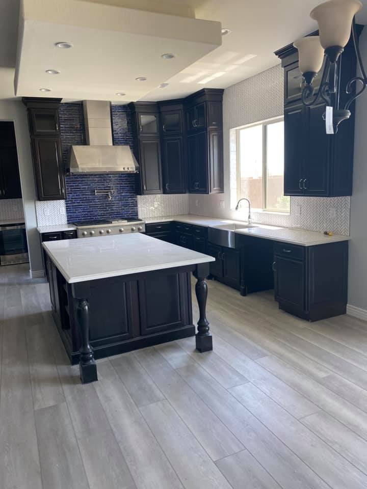 There is a large island in the middle of the kitchen.