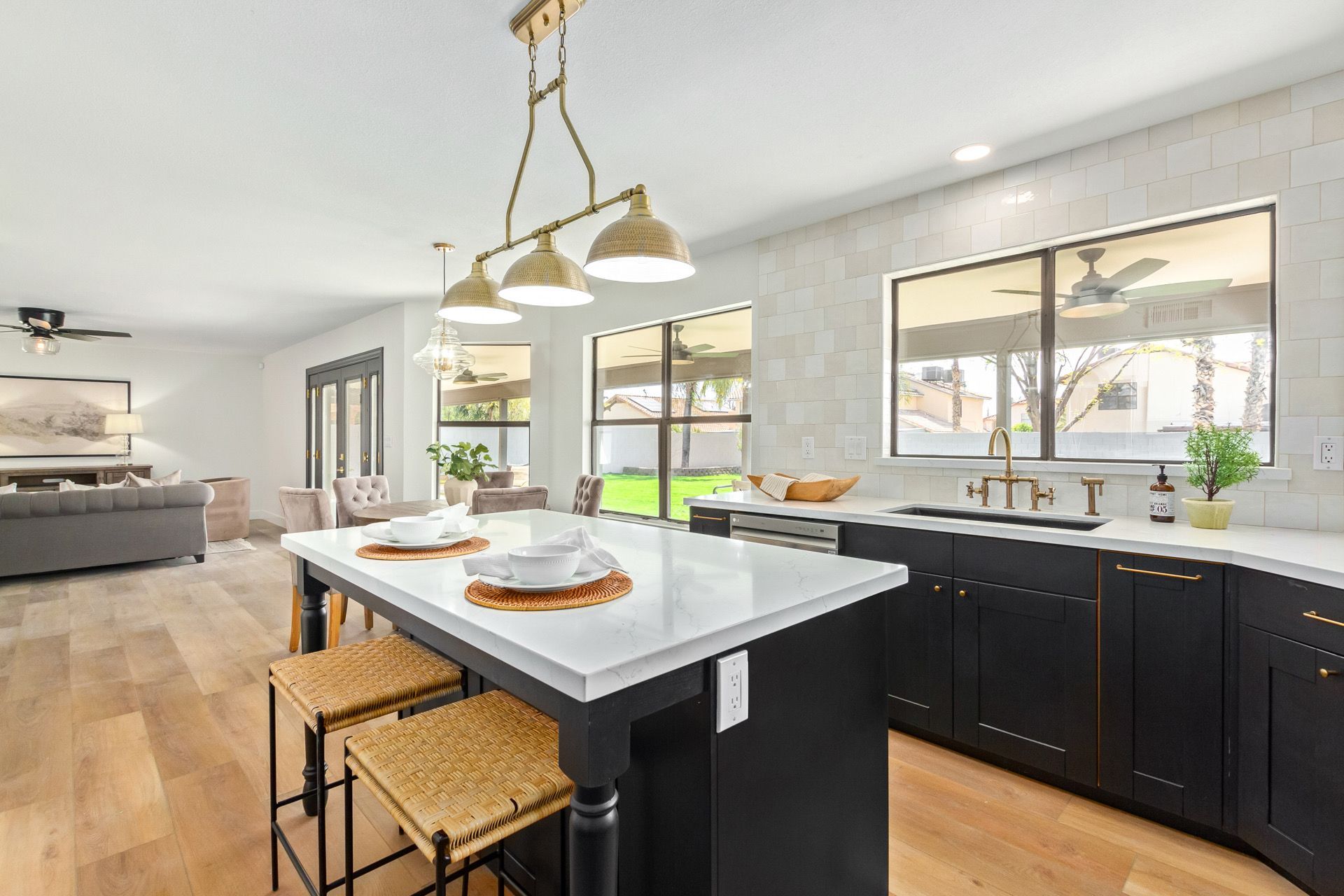 A stone fireplace with a wooden bench in front of it.