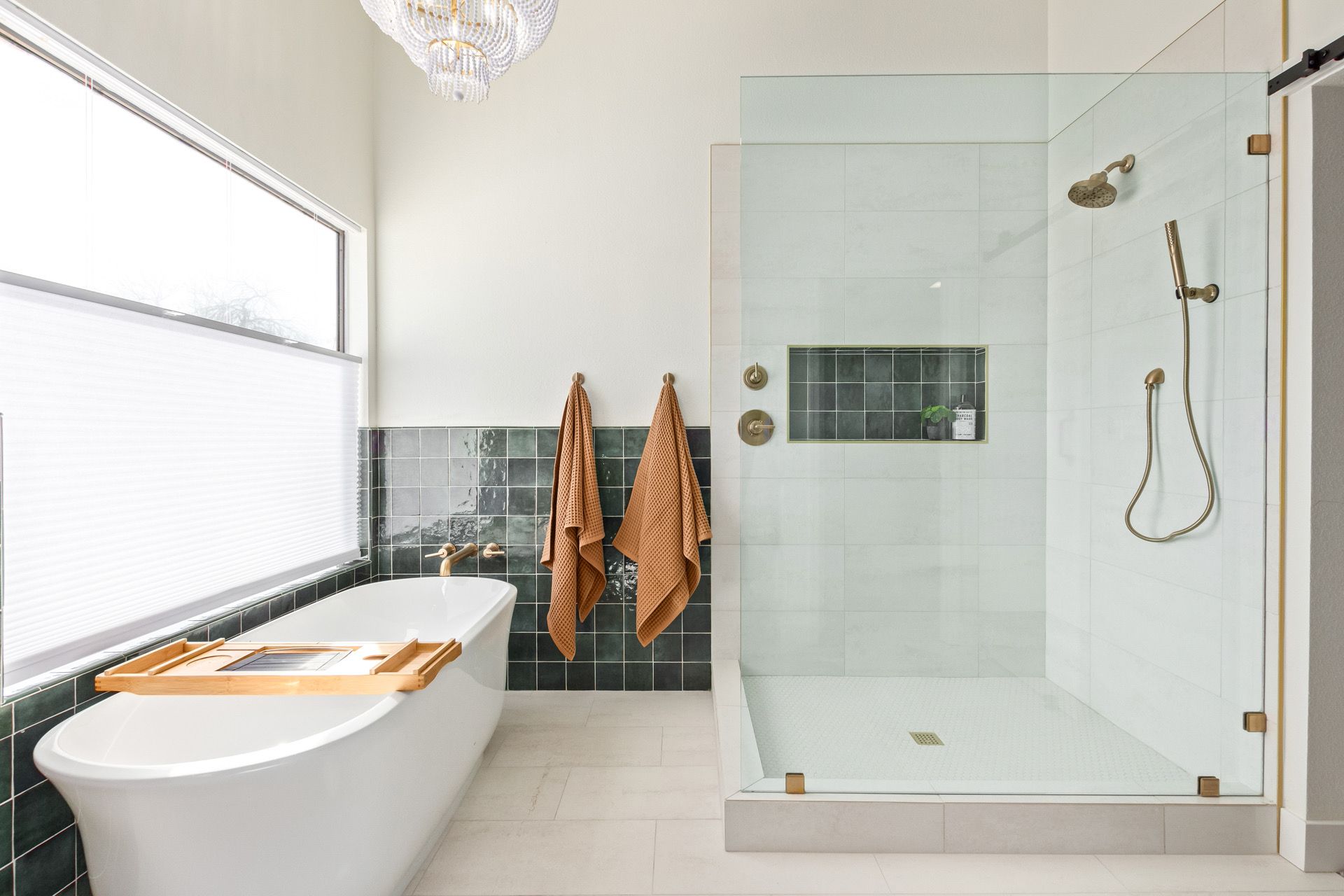 A bathroom with a bathtub and a walk in shower.