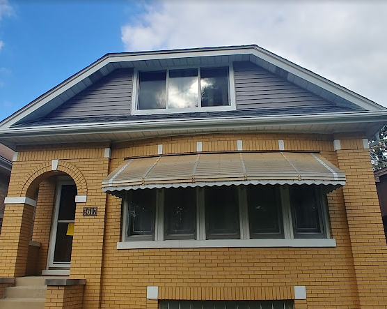 Brick bungalow spot tuckpointing repair in the Chicago suburbs