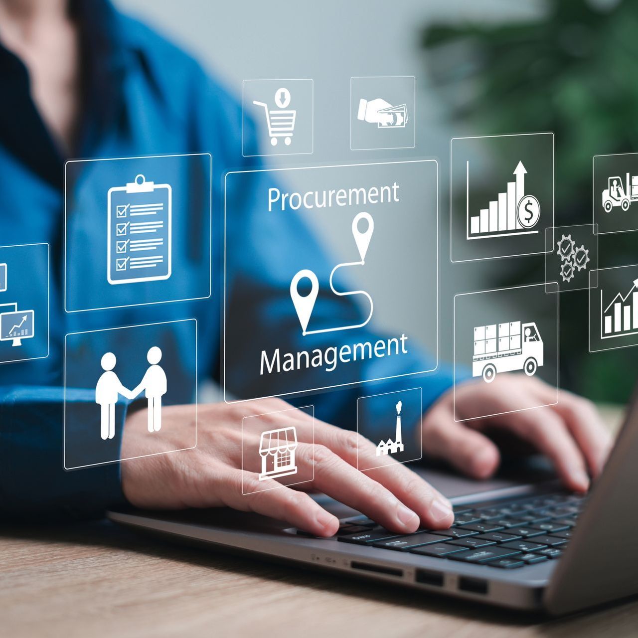 A person is typing on a laptop with a screen that says procurement management