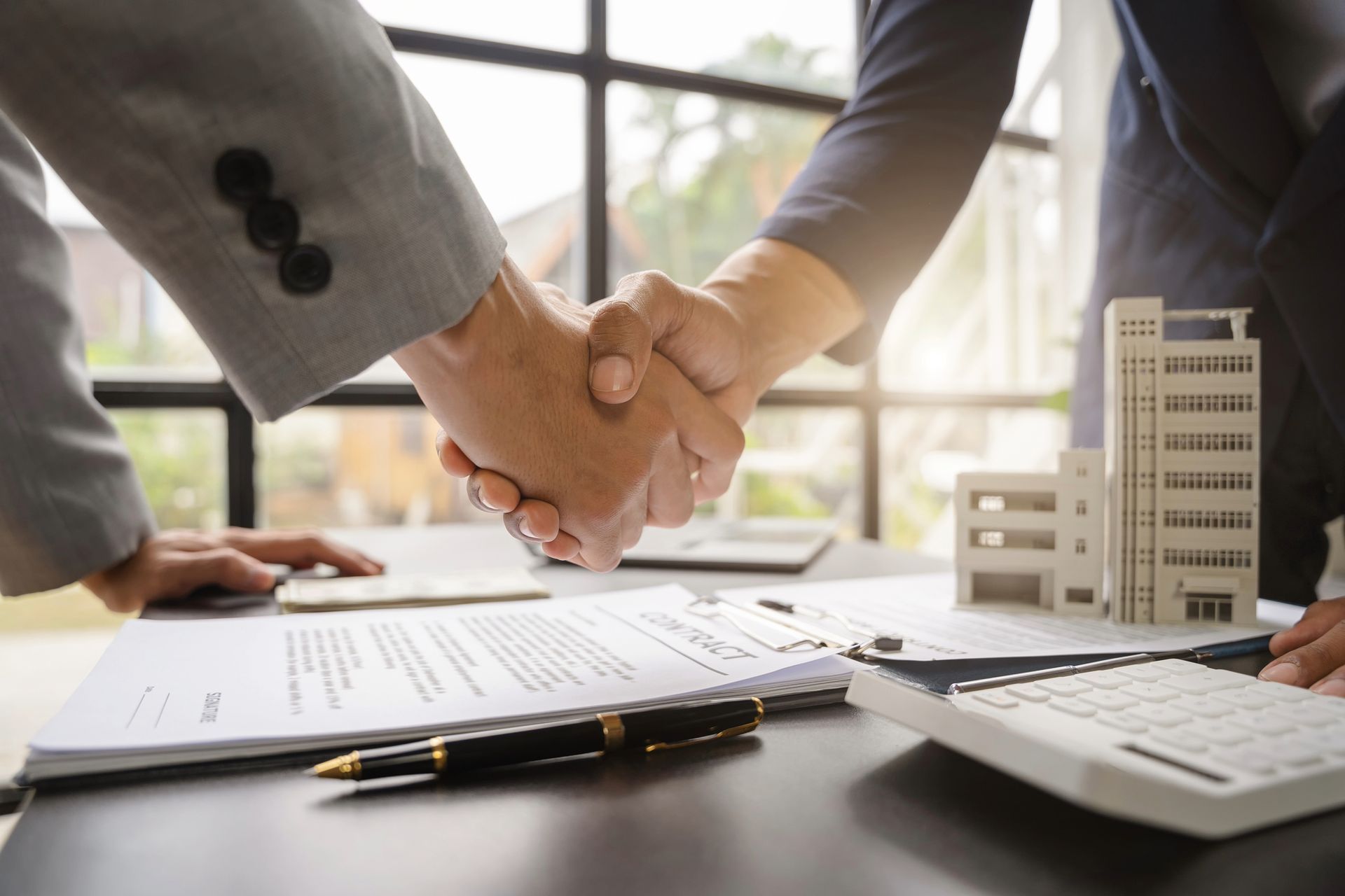 Two professionals shaking hands.