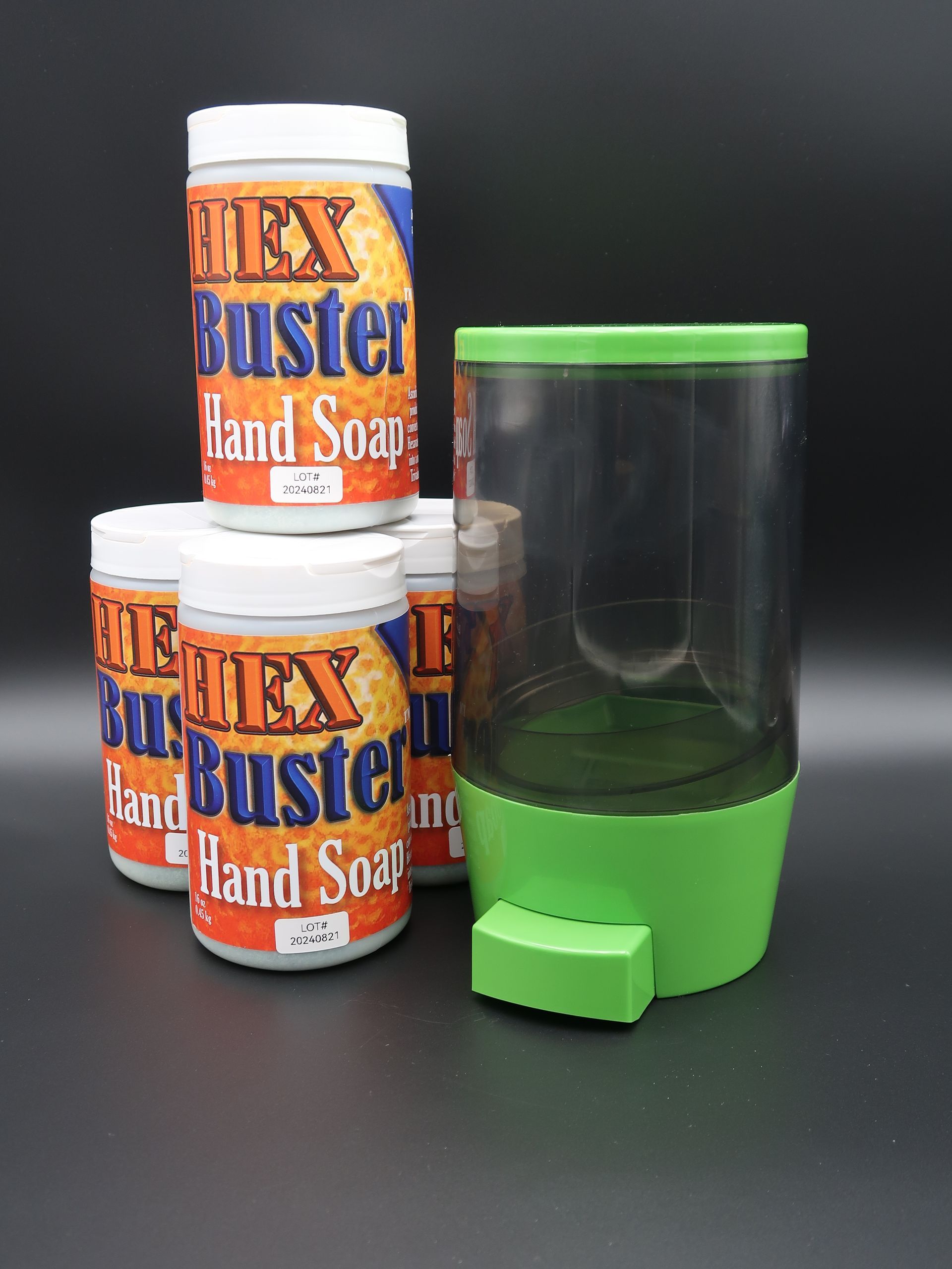 Four Flex Buster hand soap containers with a green dispenser on a black background.