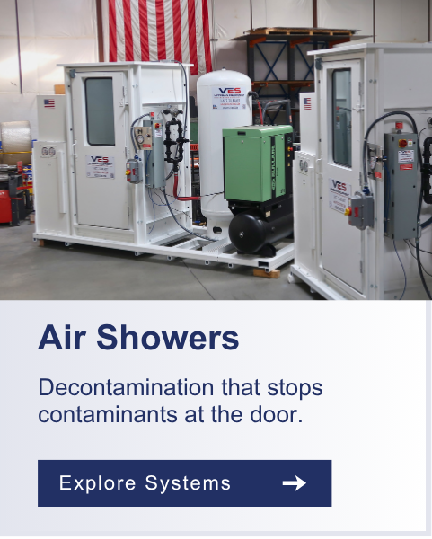 Air Showers
Industrial personnel air shower system with white and green filtration units in a facility.