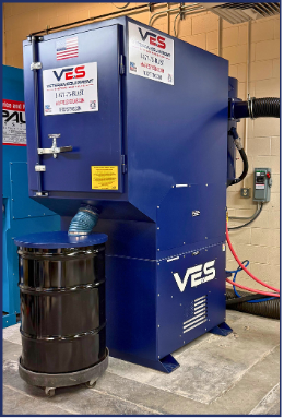 Close-up of VES Raptor blast cabinet dust collector cabinet with equipment labels and hose connection.