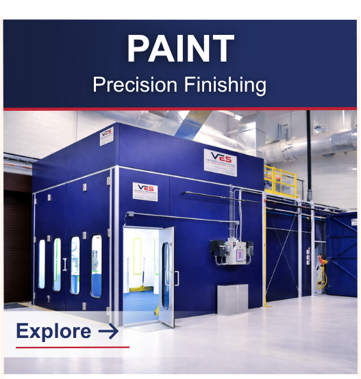 VES paint booth and precision finishing facility with blue industrial paint enclosure, access doors, and ventilation system