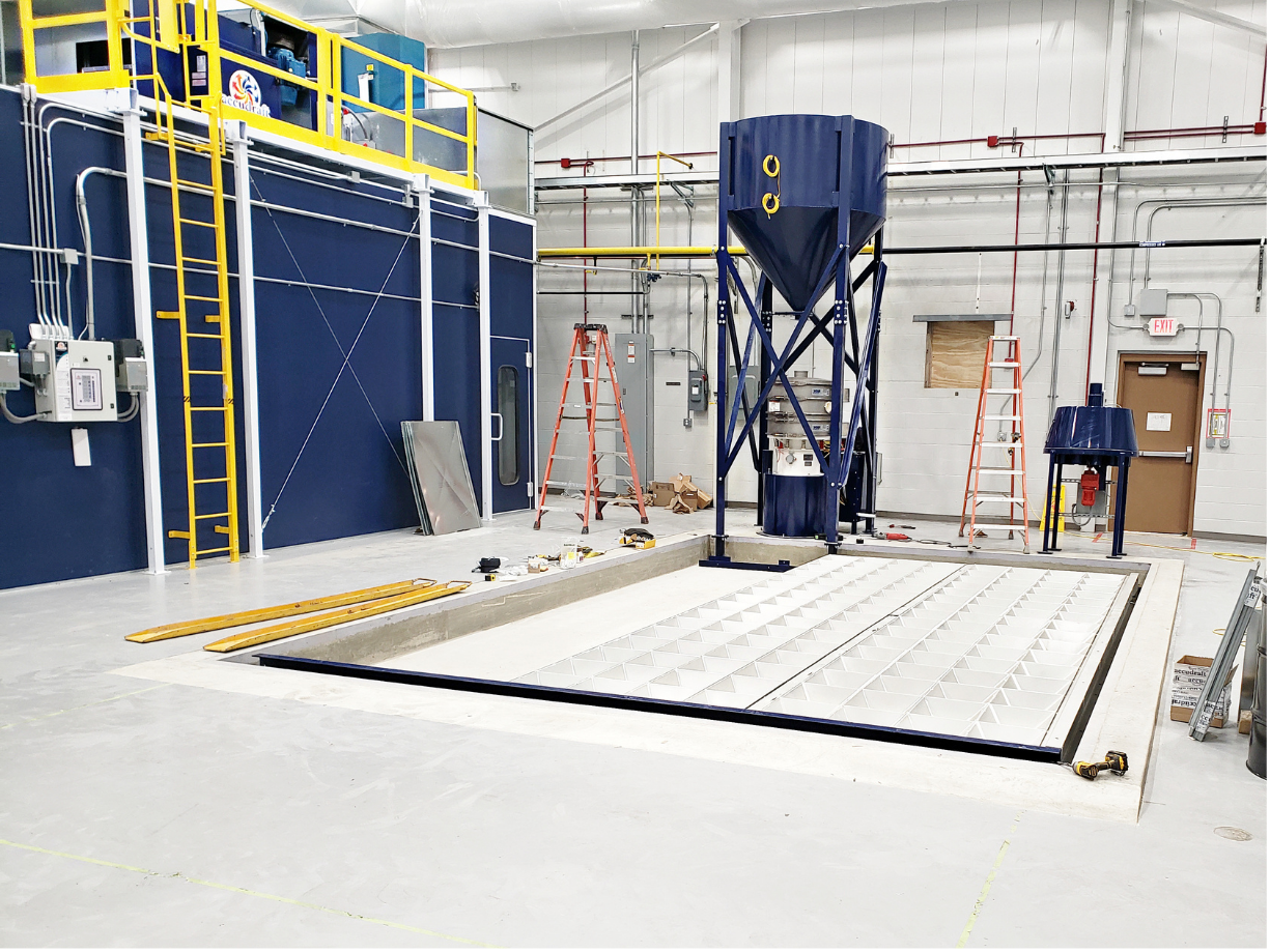 Industrial blast booth installation with dust collection equipment