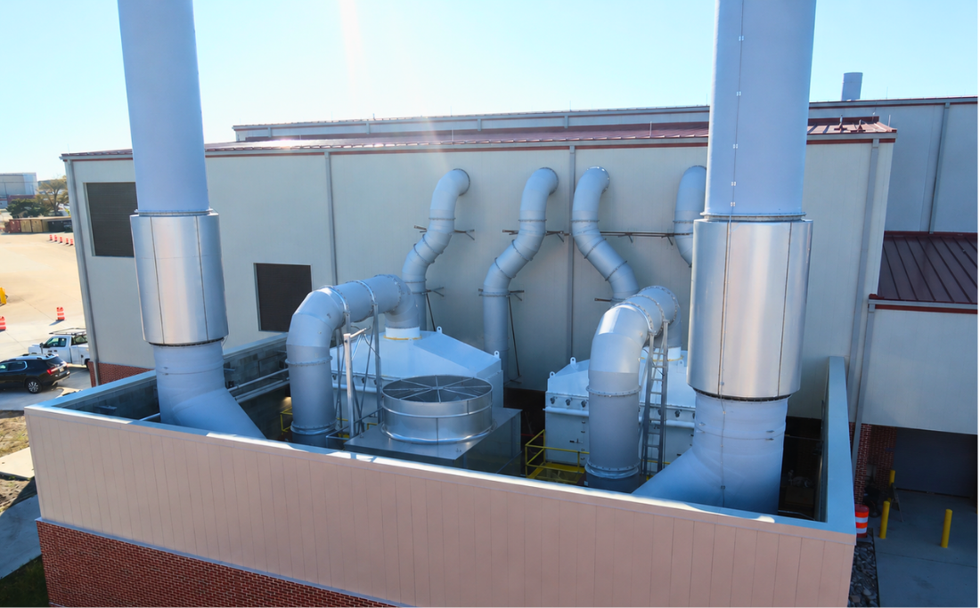 Industrial ventilation and dust collection equipment serving a finishing facility