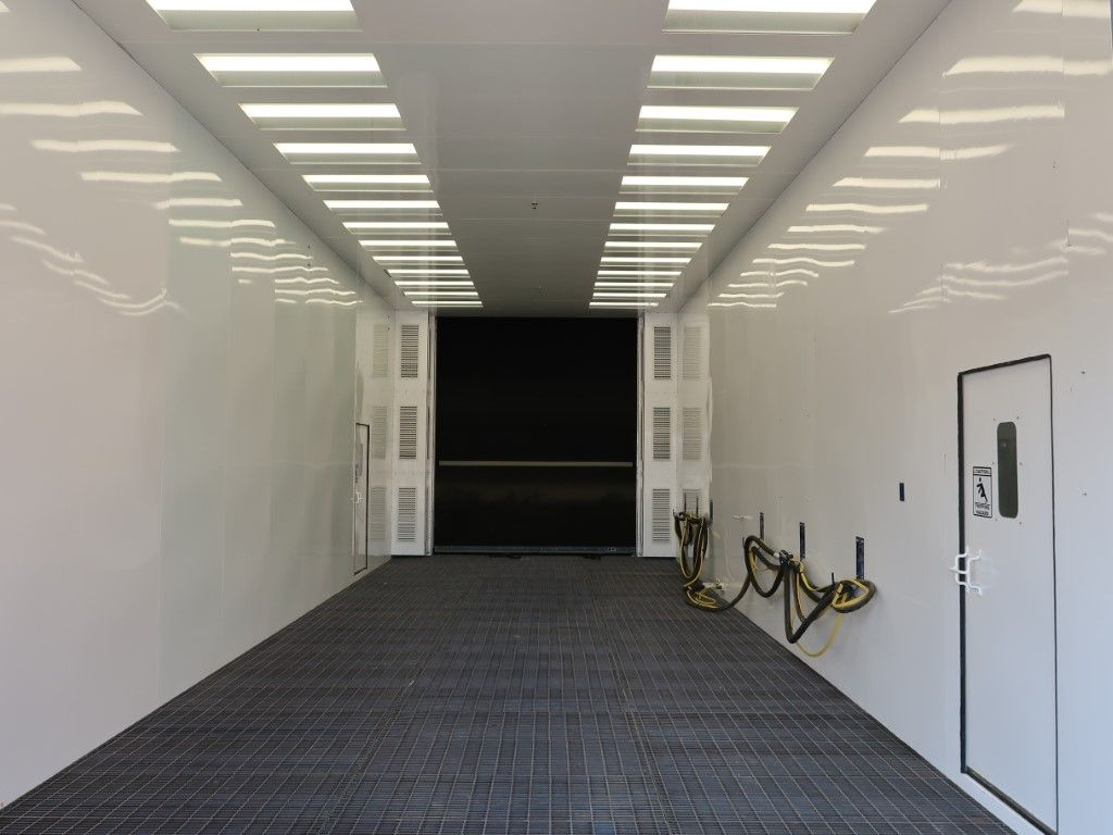 White blast booth with LED lighting.
